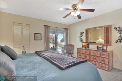 WELL CARED FOR 2/2 ON THE GOLF COURSE W/ LOVELY LAKE VIEW! on Wynmoor Golf Course in Florida - for sale on GolfHomes.com, golf home, golf lot