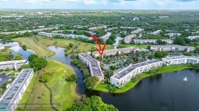 WELL CARED FOR 2/2 ON THE GOLF COURSE W/ LOVELY LAKE VIEW! on Wynmoor Golf Course in Florida - for sale on GolfHomes.com, golf home, golf lot