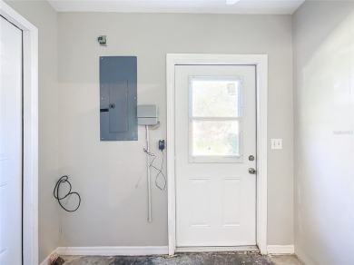 Lovely stucco turn-key 3 bedroom/2 bath, ASPEN style home in on Eagle Ridge At Spruce Creek Country Club in Florida - for sale on GolfHomes.com, golf home, golf lot