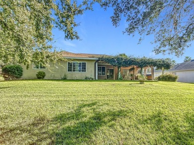 Lovely stucco turn-key 3 bedroom/2 bath, ASPEN style home in on Eagle Ridge At Spruce Creek Country Club in Florida - for sale on GolfHomes.com, golf home, golf lot