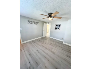 Welcome to this beautifully maintained two-bedroom, two-bath on Lake Fairways Country Club in Florida - for sale on GolfHomes.com, golf home, golf lot