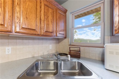 Surrounded by the natural beauty of Holiday Island, this 3 bed on Holiday Island Executive Golf Course in Arkansas - for sale on GolfHomes.com, golf home, golf lot