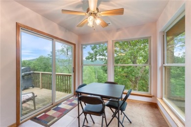 Surrounded by the natural beauty of Holiday Island, this 3 bed on Holiday Island Executive Golf Course in Arkansas - for sale on GolfHomes.com, golf home, golf lot