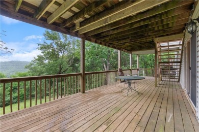 Surrounded by the natural beauty of Holiday Island, this 3 bed on Holiday Island Executive Golf Course in Arkansas - for sale on GolfHomes.com, golf home, golf lot