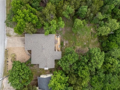 Surrounded by the natural beauty of Holiday Island, this 3 bed on Holiday Island Executive Golf Course in Arkansas - for sale on GolfHomes.com, golf home, golf lot