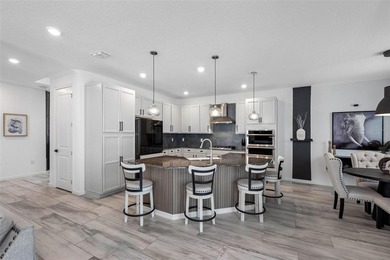 Gorgeous pool home in the gated resort-style community of on Apollo Beach Golf and Sea Club in Florida - for sale on GolfHomes.com, golf home, golf lot