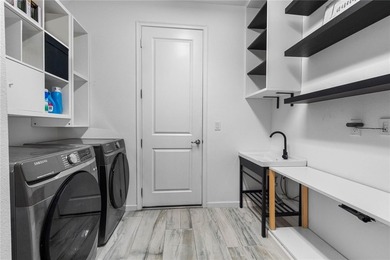 Gorgeous pool home in the gated resort-style community of on Apollo Beach Golf and Sea Club in Florida - for sale on GolfHomes.com, golf home, golf lot