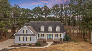 Nestled on the 12th fairway of a premier gated waterfront golf on Sound Golf Links at Albemarle Plantation in North Carolina - for sale on GolfHomes.com, golf home, golf lot