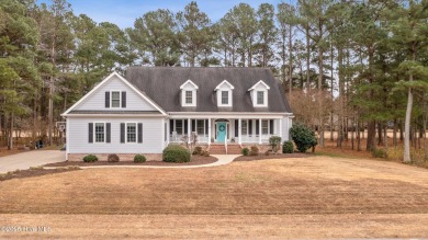 Nestled on the 12th fairway of a premier gated waterfront golf on Sound Golf Links at Albemarle Plantation in North Carolina - for sale on GolfHomes.com, golf home, golf lot