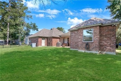 Welcome to 100 Chacahoula Lane, a classic French-style on Beau Chene Country Club in Louisiana - for sale on GolfHomes.com, golf home, golf lot