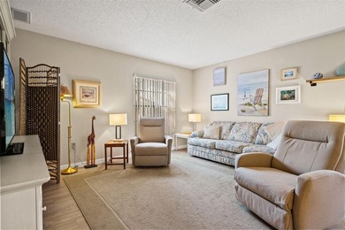 PENDING.  A MUST SEE!  Impeccably maintained, UPDATED, End unit on Timber Pines Golf Course in Florida - for sale on GolfHomes.com, golf home, golf lot