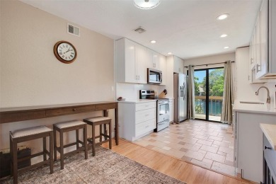 Welcome to your lakeside retreat in the heart of Plantation! on Jacaranda Golf Club in Florida - for sale on GolfHomes.com, golf home, golf lot