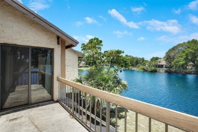 Welcome to your lakeside retreat in the heart of Plantation! on Jacaranda Golf Club in Florida - for sale on GolfHomes.com, golf home, golf lot
