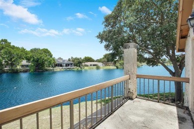 Welcome to your lakeside retreat in the heart of Plantation! on Jacaranda Golf Club in Florida - for sale on GolfHomes.com, golf home, golf lot