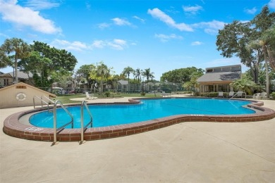 Welcome to your lakeside retreat in the heart of Plantation! on Jacaranda Golf Club in Florida - for sale on GolfHomes.com, golf home, golf lot