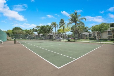 Welcome to your lakeside retreat in the heart of Plantation! on Jacaranda Golf Club in Florida - for sale on GolfHomes.com, golf home, golf lot