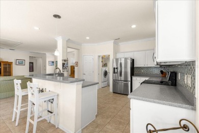 Discover this well-maintained 2 bedroom, 2 bath home plus a den on Eagle Ridge At Spruce Creek Country Club in Florida - for sale on GolfHomes.com, golf home, golf lot