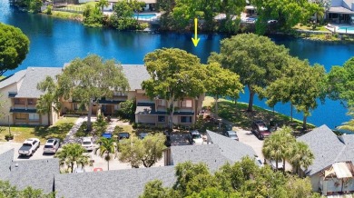 Welcome to your lakeside retreat in the heart of Plantation! on Jacaranda Golf Club in Florida - for sale on GolfHomes.com, golf home, golf lot