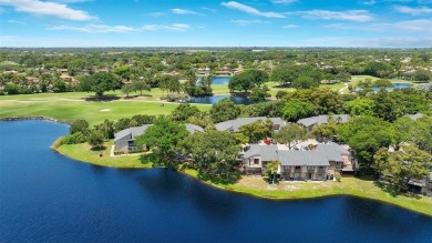 Welcome to your lakeside retreat in the heart of Plantation! on Jacaranda Golf Club in Florida - for sale on GolfHomes.com, golf home, golf lot