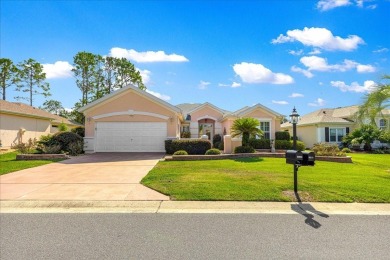 Discover this well-maintained 2 bedroom, 2 bath home plus a den on Eagle Ridge At Spruce Creek Country Club in Florida - for sale on GolfHomes.com, golf home, golf lot