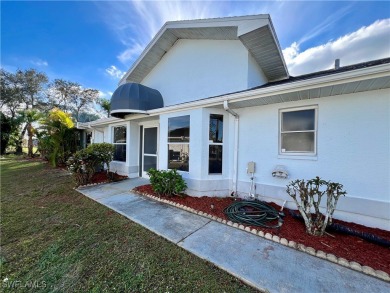 Affordable POOL HOME overlooking the GOLF COURSE. Pay as you on Lehigh Resort Club in Florida - for sale on GolfHomes.com, golf home, golf lot