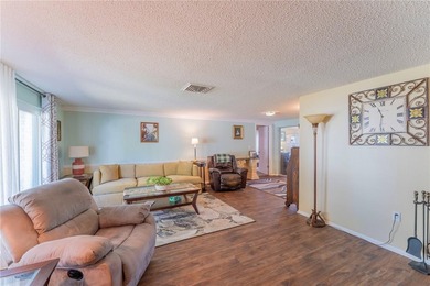 Welcome to this spacious 3-bedroom, 2-bathroom split-plan home on Beacon Woods Golf Club in Florida - for sale on GolfHomes.com, golf home, golf lot