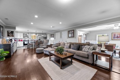 Welcome to this stunning 3-bedroom, 2.5-bathroom brick ranch on Harbour Point Golf Club in North Carolina - for sale on GolfHomes.com, golf home, golf lot