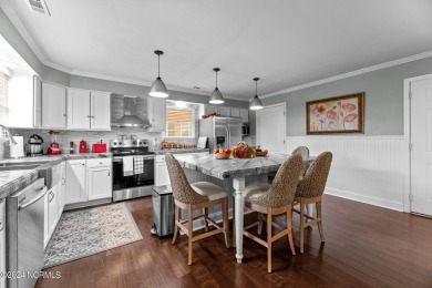 Welcome to this stunning 3-bedroom, 2.5-bathroom brick ranch on Harbour Point Golf Club in North Carolina - for sale on GolfHomes.com, golf home, golf lot