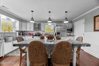 Welcome to this stunning 3-bedroom, 2.5-bathroom brick ranch on Harbour Point Golf Club in North Carolina - for sale on GolfHomes.com, golf home, golf lot