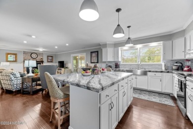 Welcome to this stunning 3-bedroom, 2.5-bathroom brick ranch on Harbour Point Golf Club in North Carolina - for sale on GolfHomes.com, golf home, golf lot