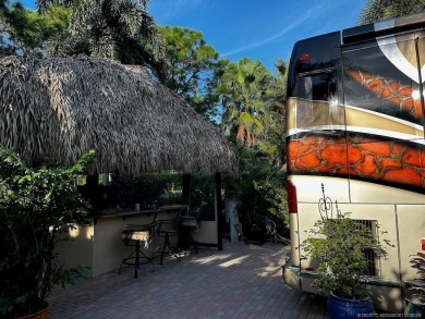 Discover the perfect combination of privacy, space, and luxury on Motorcoach Resort Golf Course in Florida - for sale on GolfHomes.com, golf home, golf lot