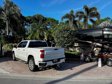 Discover the perfect combination of privacy, space, and luxury on Motorcoach Resort Golf Course in Florida - for sale on GolfHomes.com, golf home, golf lot