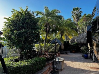 Discover the perfect combination of privacy, space, and luxury on Motorcoach Resort Golf Course in Florida - for sale on GolfHomes.com, golf home, golf lot