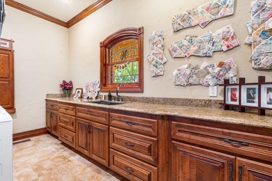 Experience refined living in this exquisite 4-bedroom, 4.5-bath on Highland Springs Country Club in Missouri - for sale on GolfHomes.com, golf home, golf lot