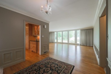 Discover the ease of single-level living with stunning vistas of on Country Club of Detroit - Regulation in Michigan - for sale on GolfHomes.com, golf home, golf lot