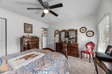 Welcome to this stunning 3-bedroom, 2.5-bathroom brick ranch on Harbour Point Golf Club in North Carolina - for sale on GolfHomes.com, golf home, golf lot