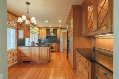 Discover the ease of single-level living with stunning vistas of on Country Club of Detroit - Regulation in Michigan - for sale on GolfHomes.com, golf home, golf lot