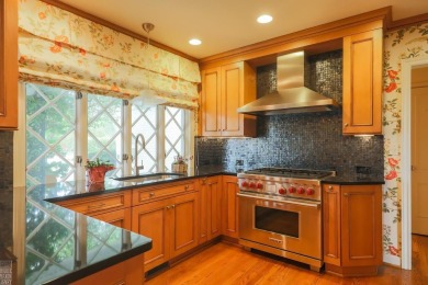 Discover the ease of single-level living with stunning vistas of on Country Club of Detroit - Regulation in Michigan - for sale on GolfHomes.com, golf home, golf lot