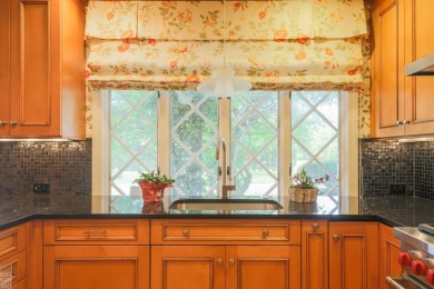 Discover the ease of single-level living with stunning vistas of on Country Club of Detroit - Regulation in Michigan - for sale on GolfHomes.com, golf home, golf lot