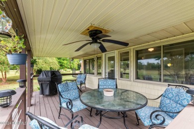 Welcome to this stunning 3-bedroom, 2.5-bathroom brick ranch on Harbour Point Golf Club in North Carolina - for sale on GolfHomes.com, golf home, golf lot