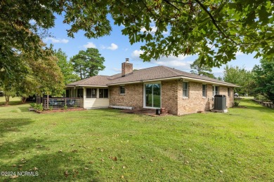 Welcome to this stunning 3-bedroom, 2.5-bathroom brick ranch on Harbour Point Golf Club in North Carolina - for sale on GolfHomes.com, golf home, golf lot