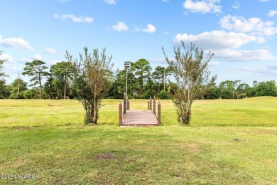 Welcome to this stunning 3-bedroom, 2.5-bathroom brick ranch on Harbour Point Golf Club in North Carolina - for sale on GolfHomes.com, golf home, golf lot