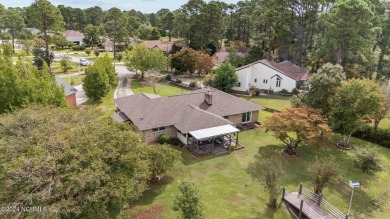 Welcome to this stunning 3-bedroom, 2.5-bathroom brick ranch on Harbour Point Golf Club in North Carolina - for sale on GolfHomes.com, golf home, golf lot