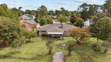 Welcome to this stunning 3-bedroom, 2.5-bathroom brick ranch on Harbour Point Golf Club in North Carolina - for sale on GolfHomes.com, golf home, golf lot