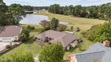 Welcome to this stunning 3-bedroom, 2.5-bathroom brick ranch on Harbour Point Golf Club in North Carolina - for sale on GolfHomes.com, golf home, golf lot