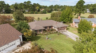 Welcome to this stunning 3-bedroom, 2.5-bathroom brick ranch on Harbour Point Golf Club in North Carolina - for sale on GolfHomes.com, golf home, golf lot