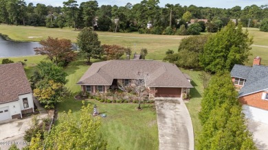 Welcome to this stunning 3-bedroom, 2.5-bathroom brick ranch on Harbour Point Golf Club in North Carolina - for sale on GolfHomes.com, golf home, golf lot