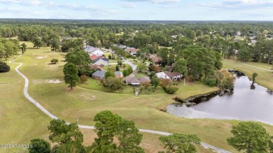 Welcome to this stunning 3-bedroom, 2.5-bathroom brick ranch on Harbour Point Golf Club in North Carolina - for sale on GolfHomes.com, golf home, golf lot