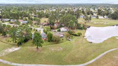 Welcome to this stunning 3-bedroom, 2.5-bathroom brick ranch on Harbour Point Golf Club in North Carolina - for sale on GolfHomes.com, golf home, golf lot