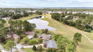 Welcome to this stunning 3-bedroom, 2.5-bathroom brick ranch on Harbour Point Golf Club in North Carolina - for sale on GolfHomes.com, golf home, golf lot